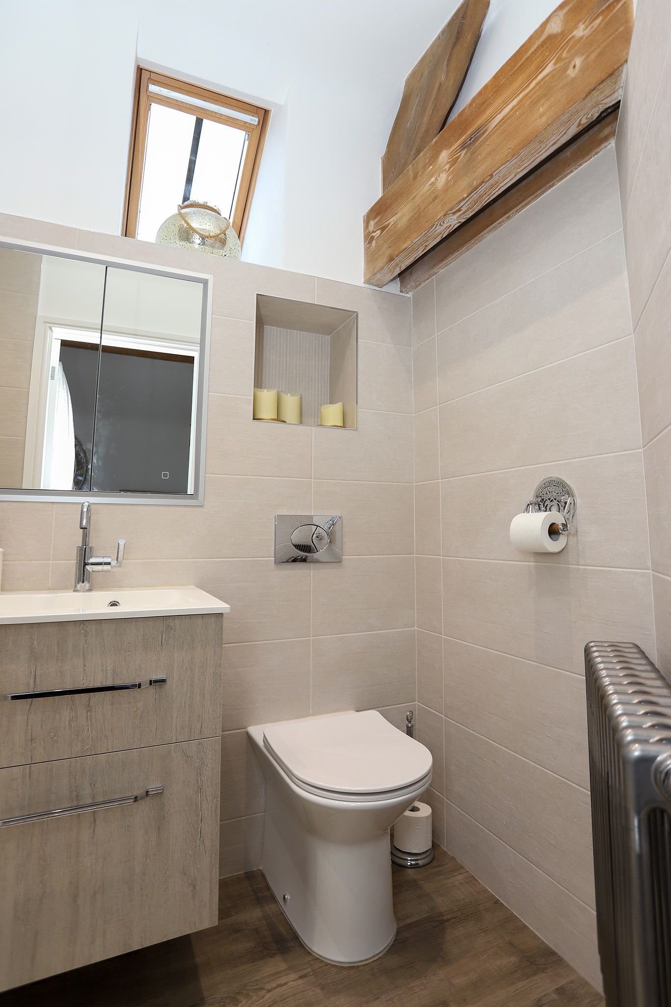 A bathroom with a toilet a sink and a mirror