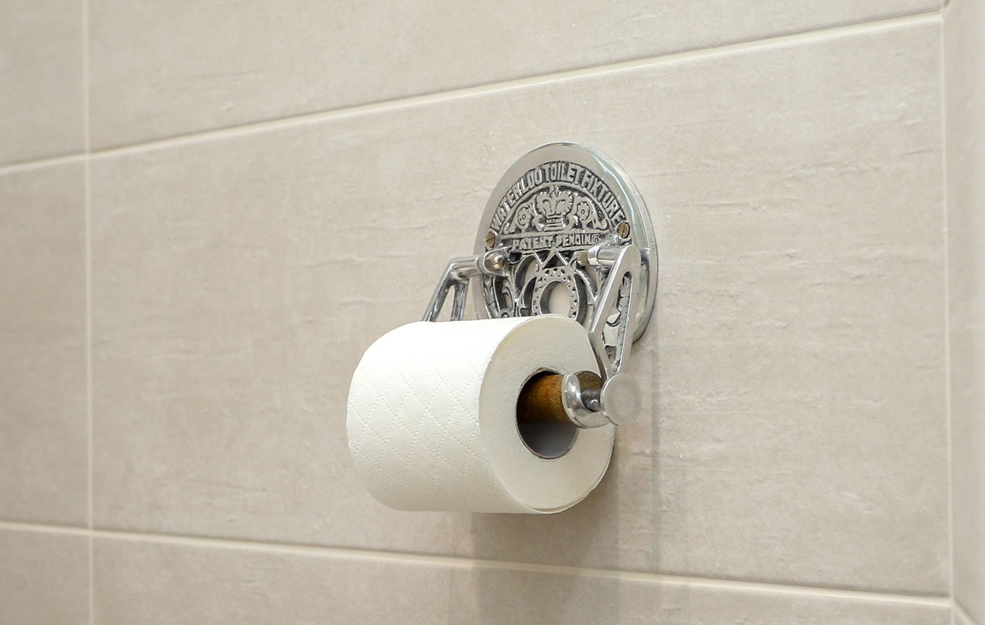 A roll of toilet paper is hanging on a toilet paper holder
