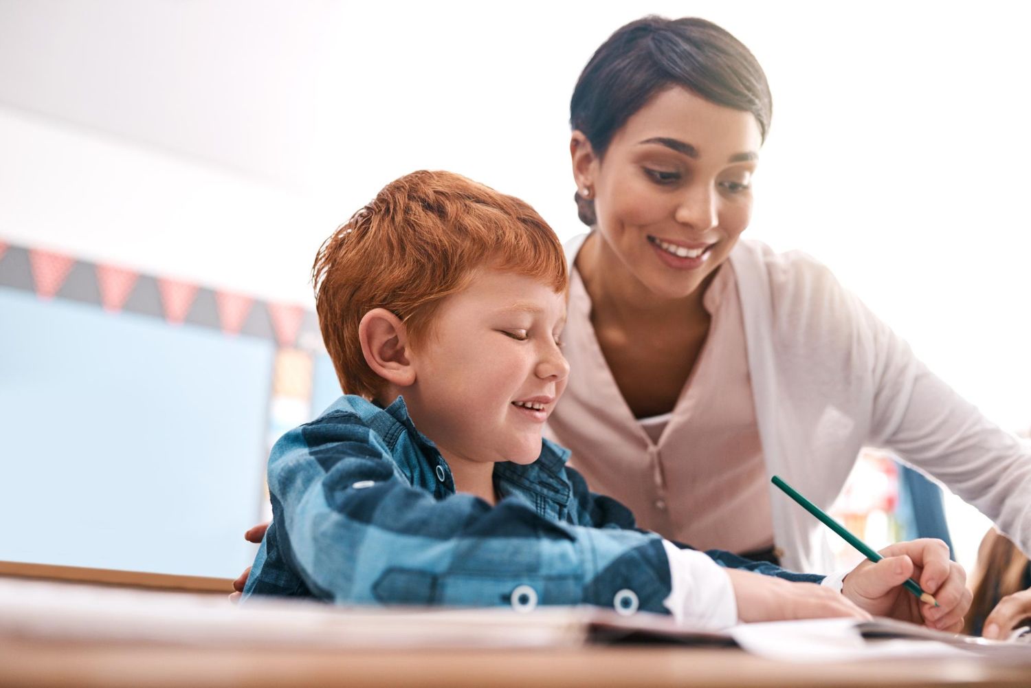 aba-therapist-and-child-with-autism-coloring-during-therapy