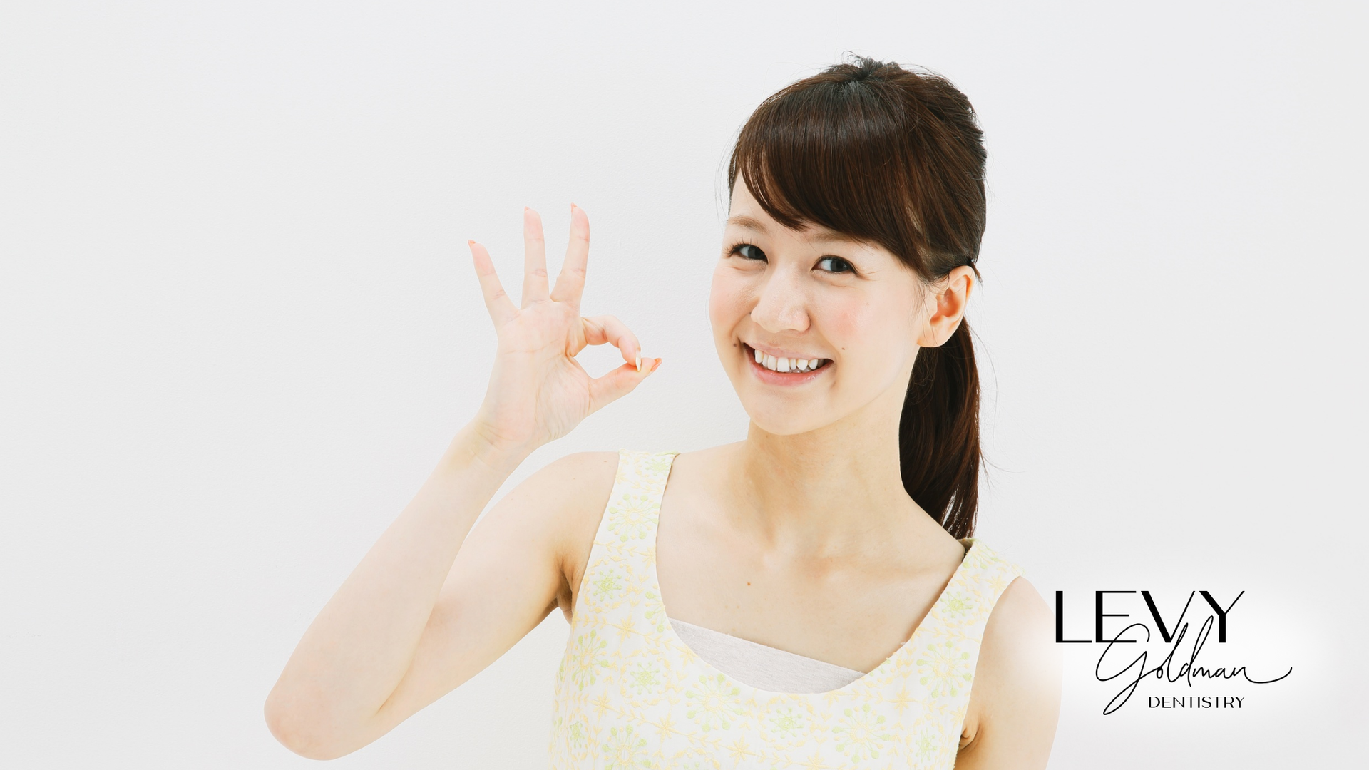 Woman smiles, giving an