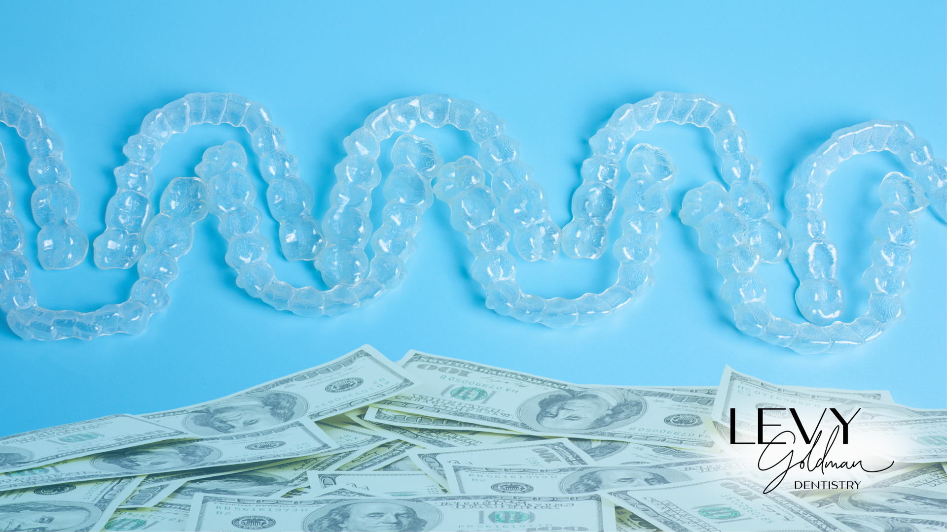 A snake is sitting on top of a pile of money on a blue background.