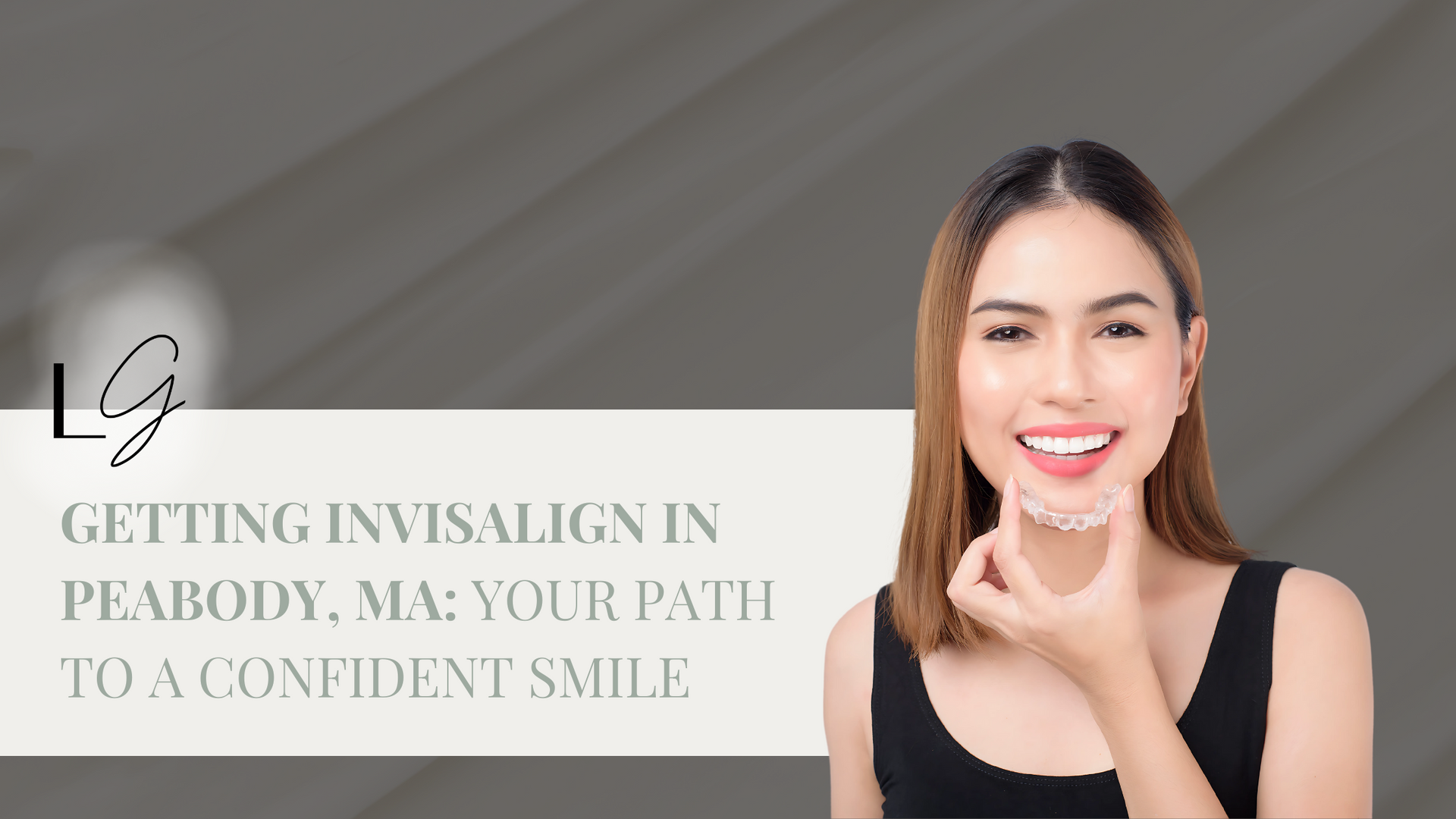 A woman is smiling while wearing an Invisalign brace on her teeth.