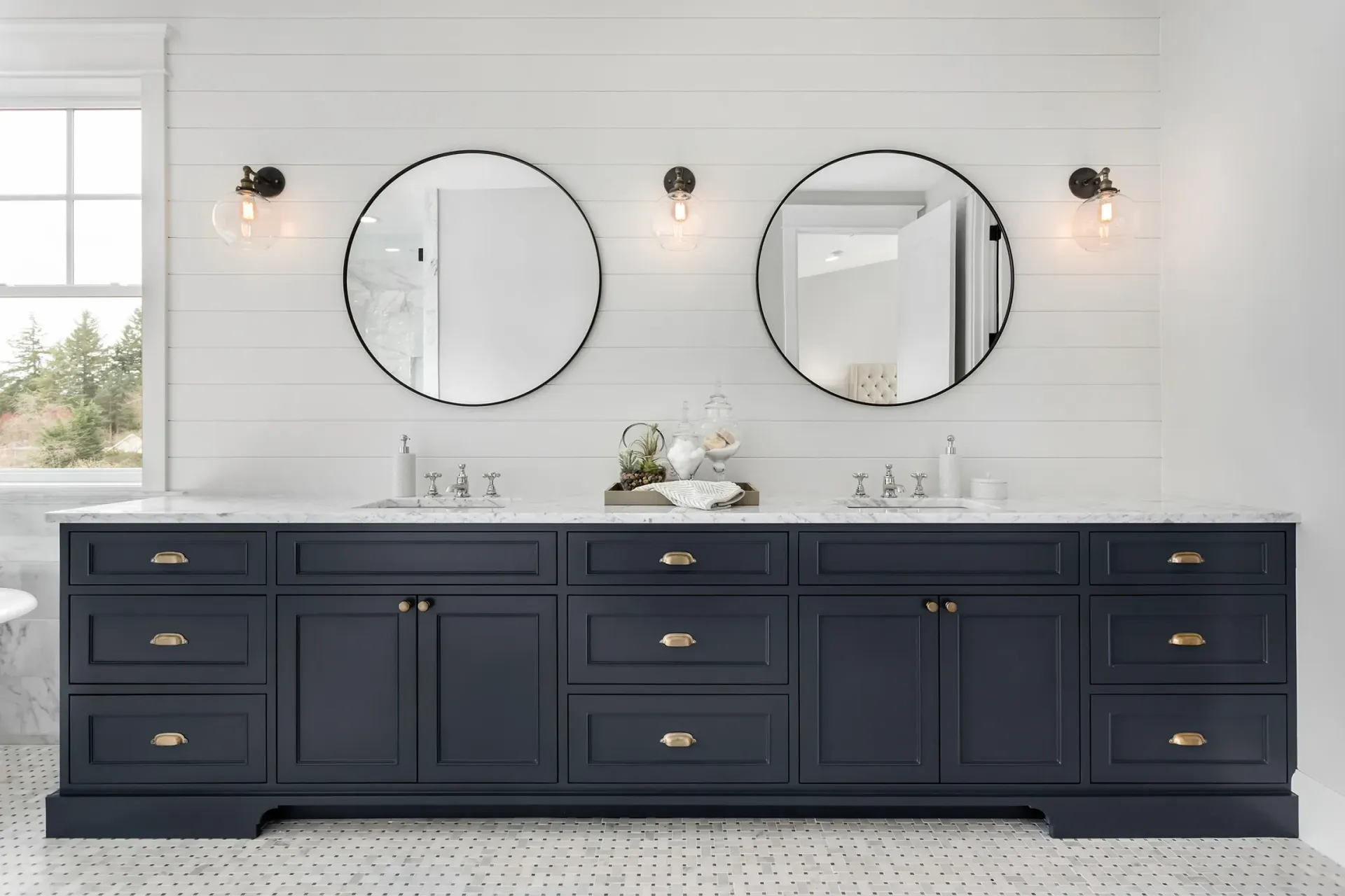 A bathroom with two sinks and two mirrors.