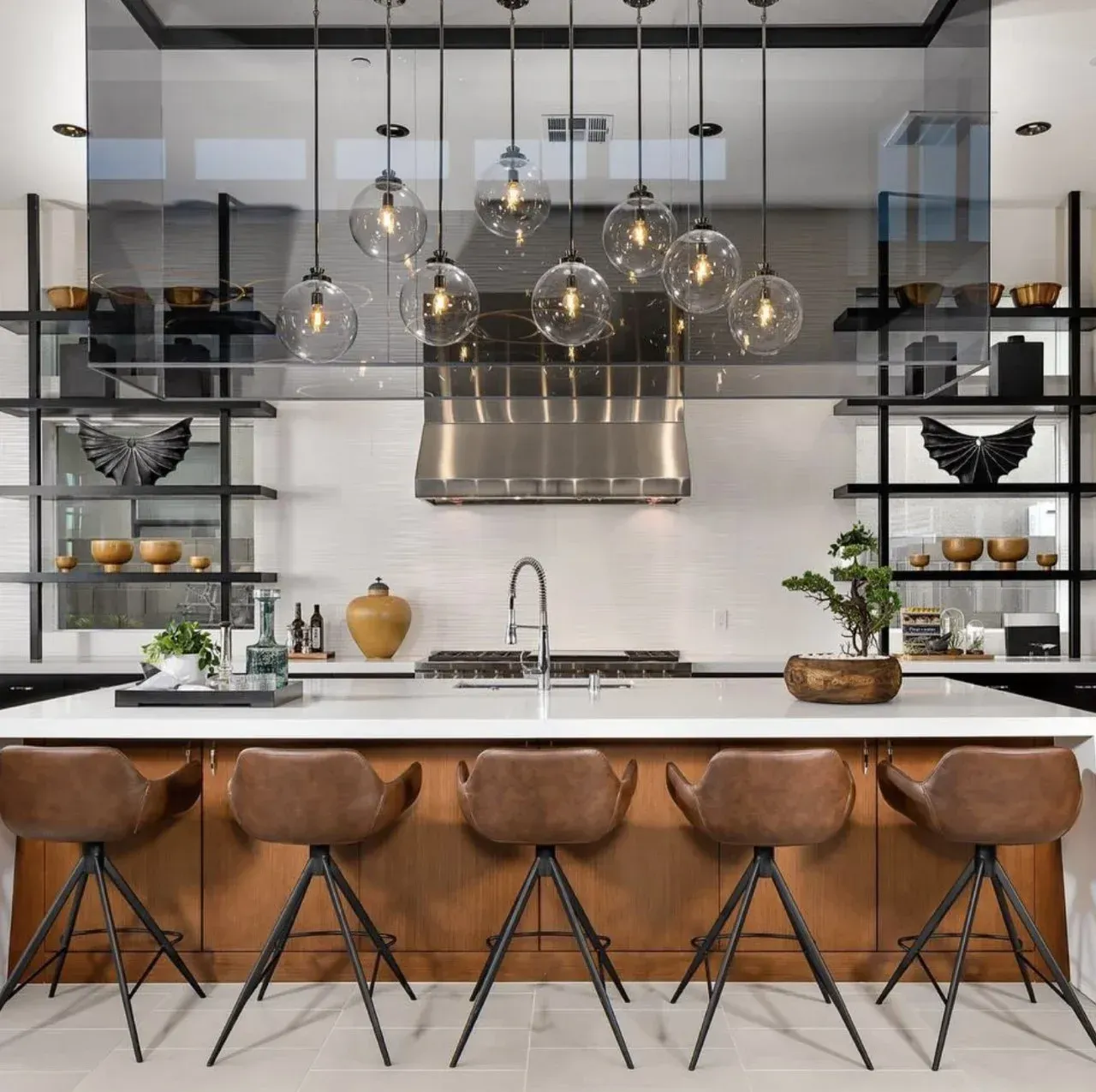 A kitchen with a large island and stools