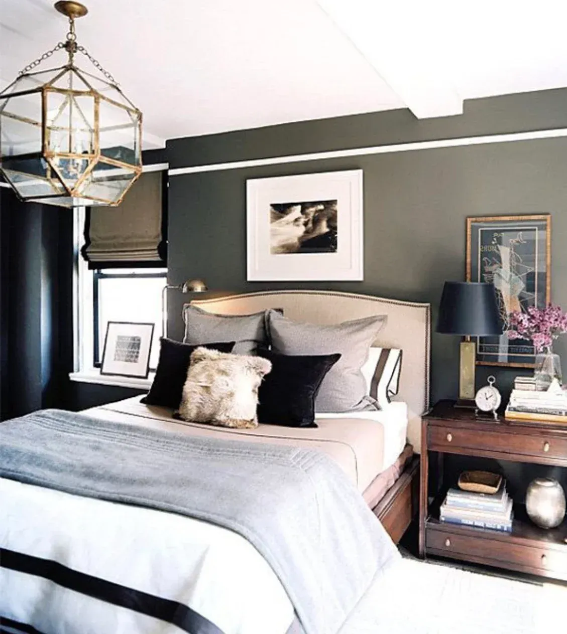 A bedroom with a large bed and a nightstand