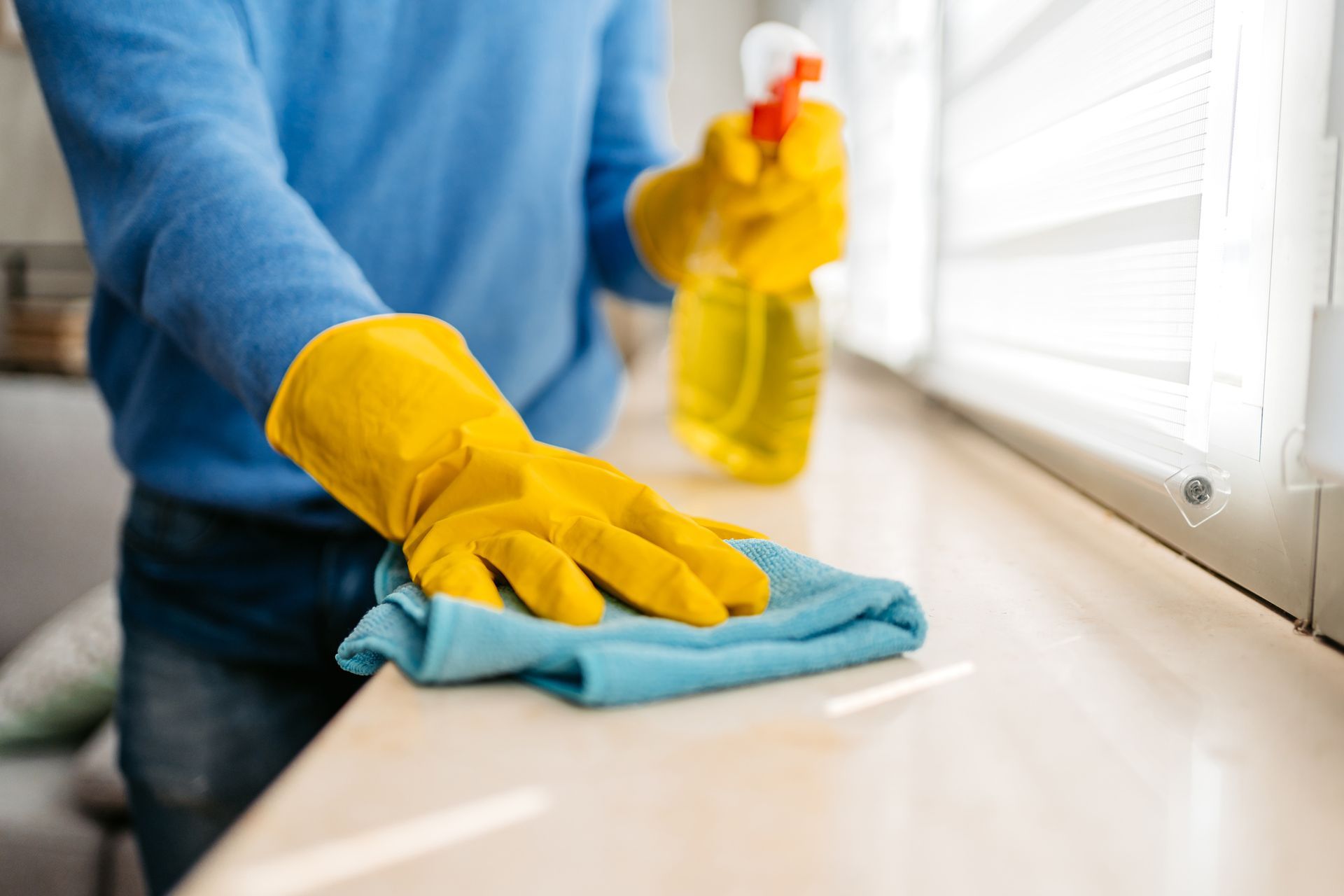 A bathroom with a bathtub and a glass shower door.