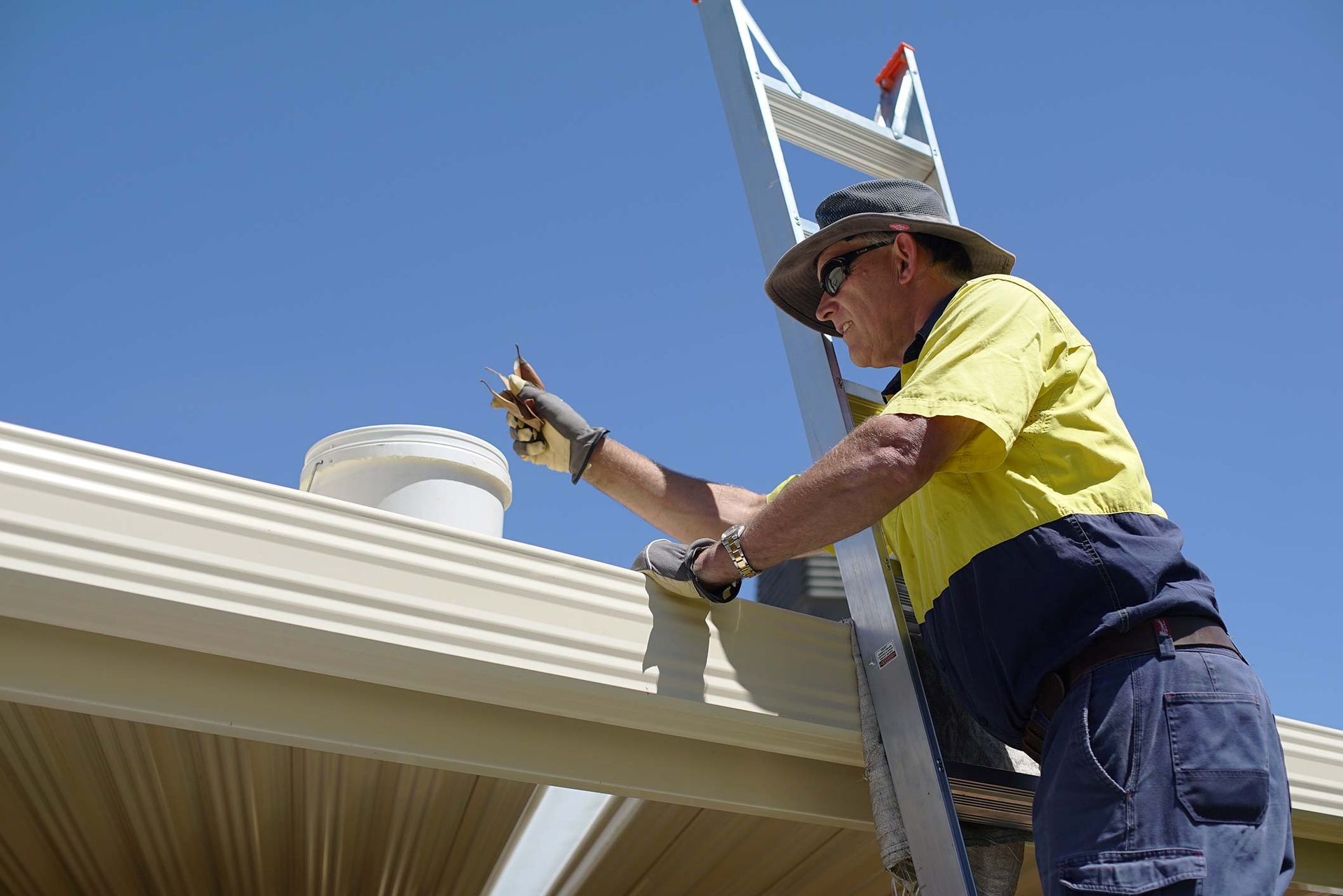 Turning On The Lawn Mower By Gardener — Lawn Mowing Services in Eaglehawk, VIC