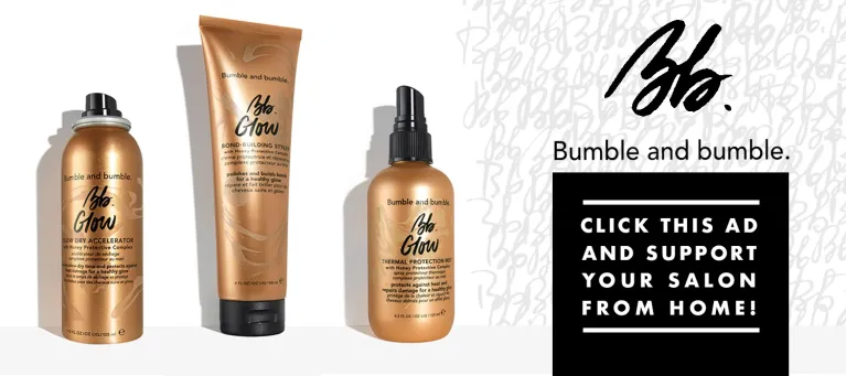 A bunch of hair products are sitting next to each other on a table.