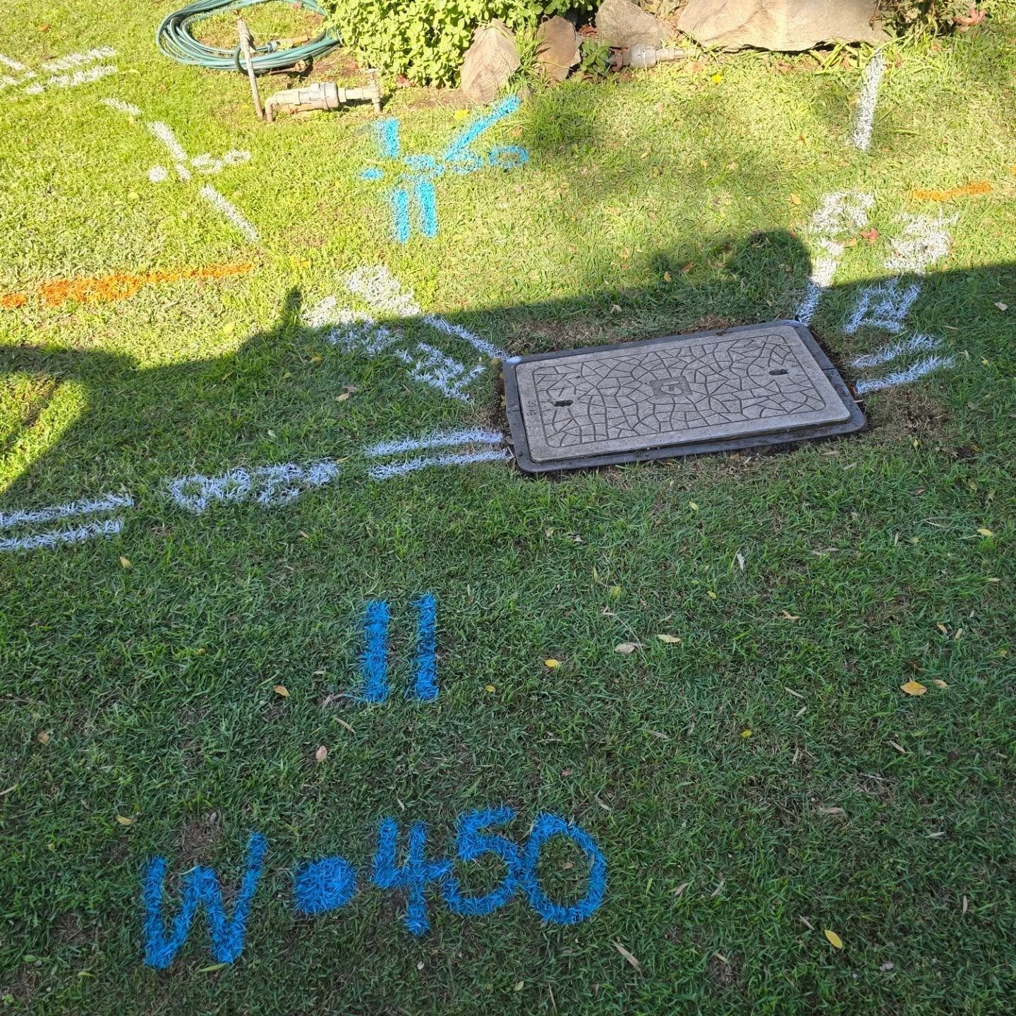 A Manhole Cover That Says Commcable on It — Dowds Pipe and Cable Locating in Farmborough Heights, NSW