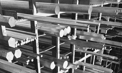 A black and white photo of a bunch of metal rods stacked on top of each other.