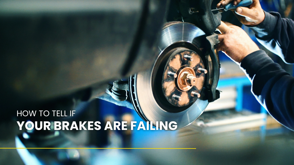 A man is fixing a brake on a car | Karta Motorwerks
