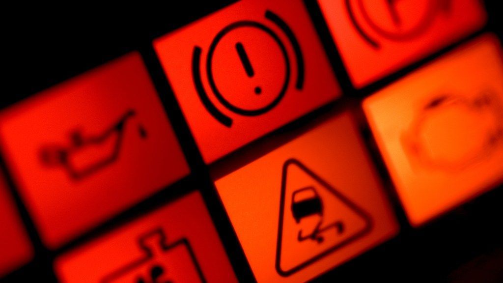 A close up of a dashboard with warning signs on it | Karta Motorwerks