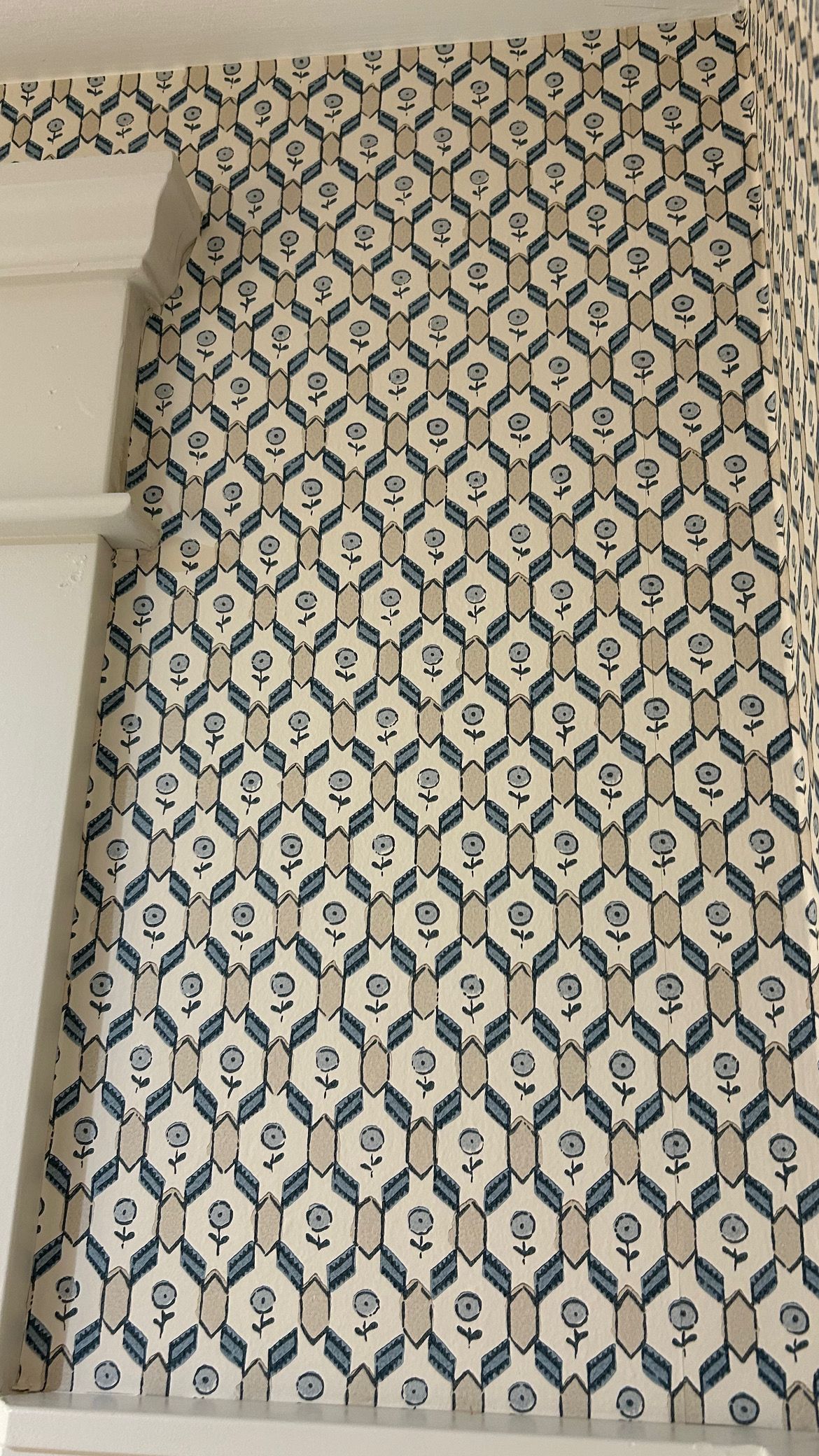 A staircase with a blue and white pattern on the floor.