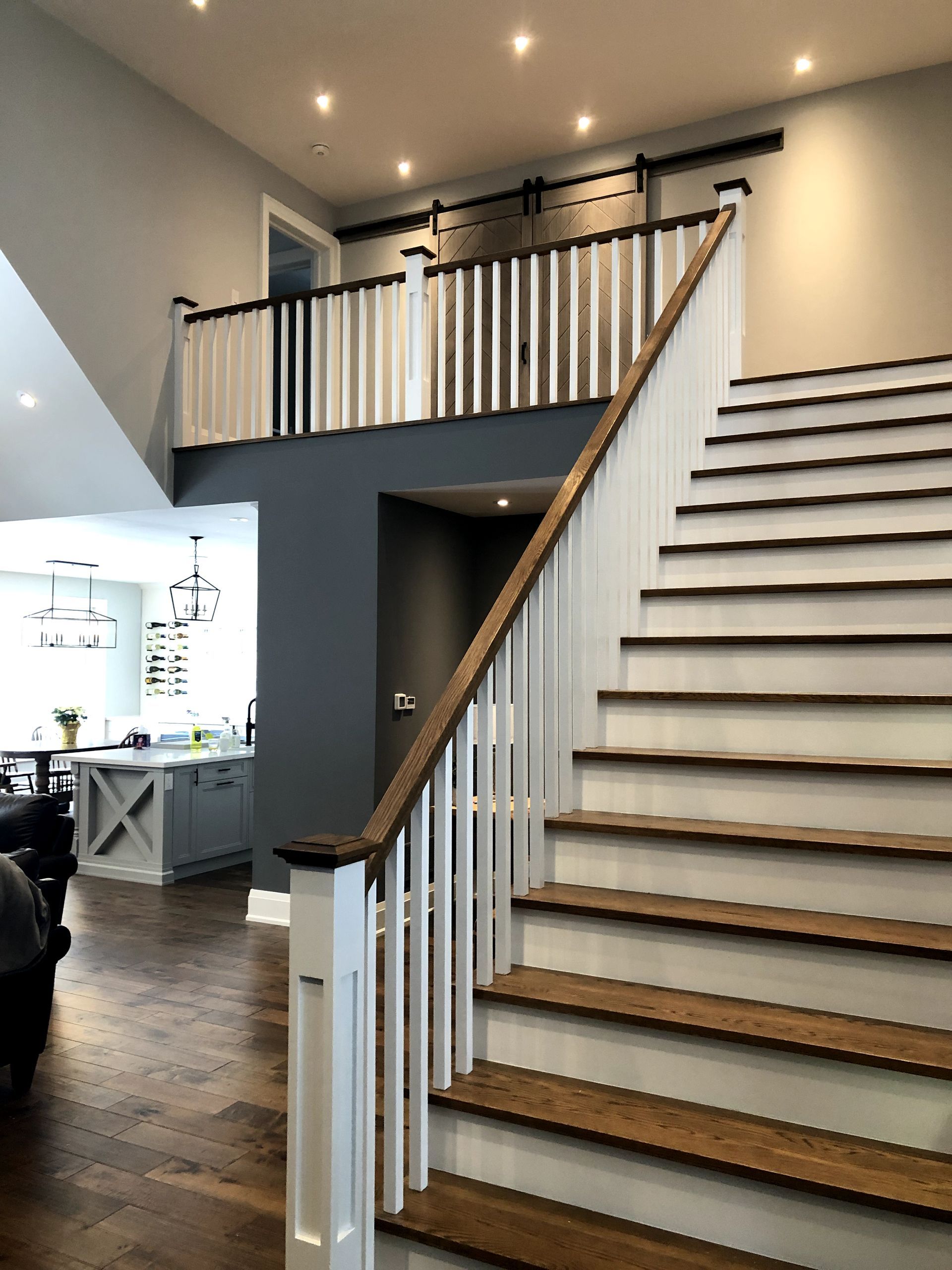 A staircase leading up to a second floor in a house.