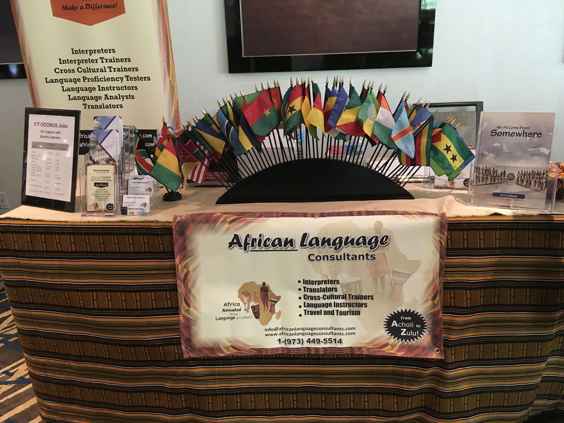 A table with a sign that says african language consultants.