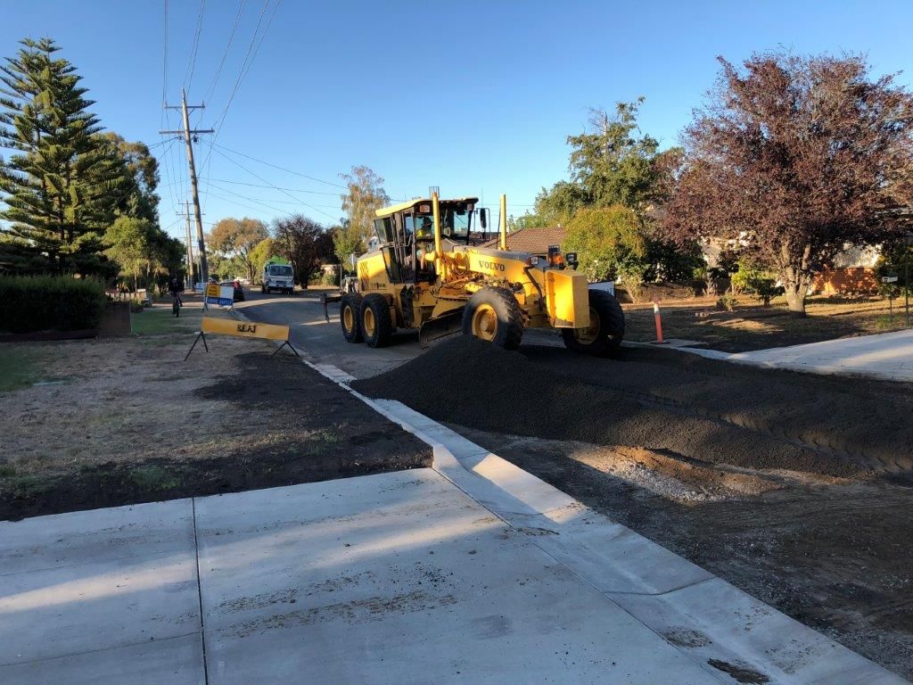 Distributing Sand on Road — Ballarat VIC — Ballarat Excavation & Transport