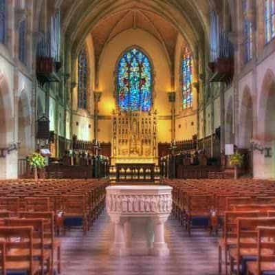A football team is running on the field with a flag that says tsl