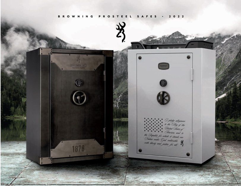 Two Browning ProSteel safes, one black and one white, against a mountainous lake backdrop.