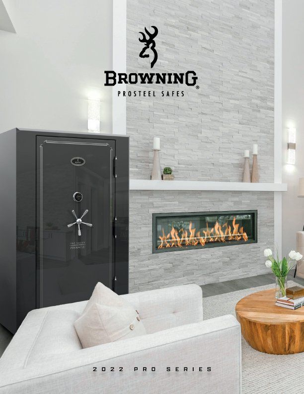 A black Browning Pro Series gun safe in a modern living room with a fireplace and a white sofa.