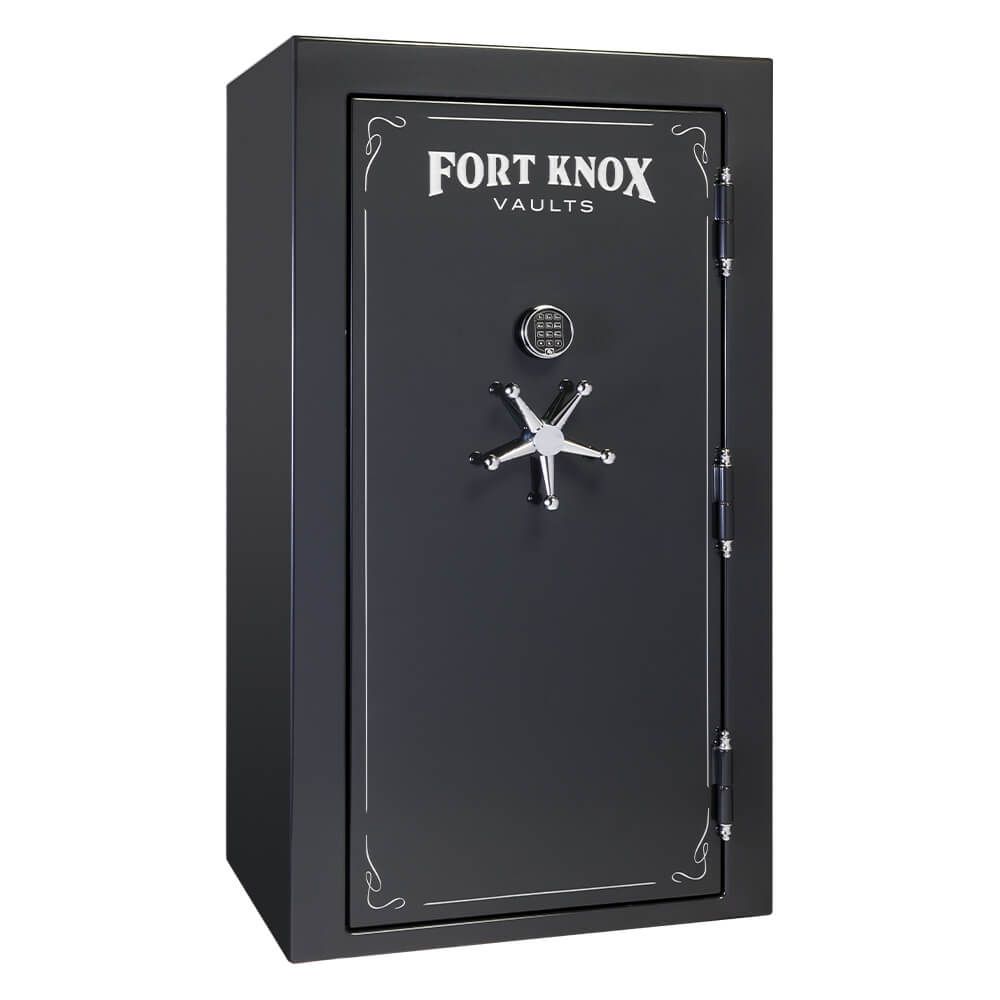 A black Fort Knox Vault safe with a combination lock and a star-shaped handle on a black surface.