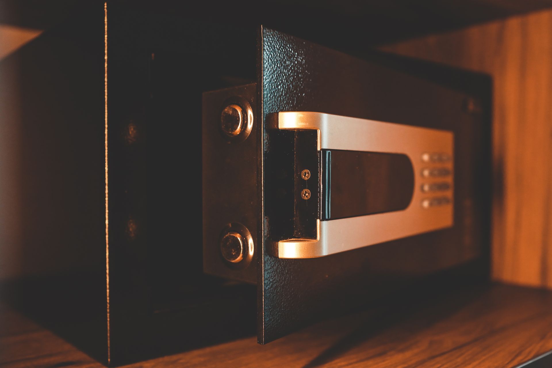 Gun safe featuring keypad entry and heavy reinforced hinges.