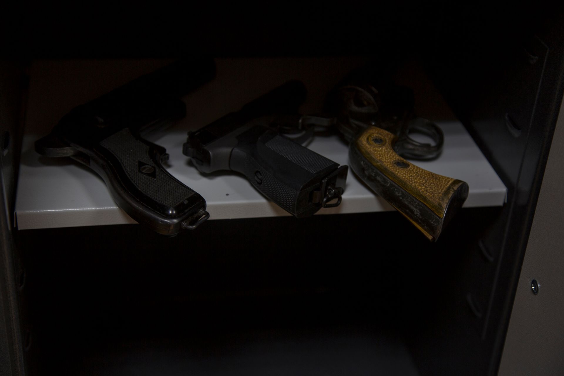A group of guns on a table | Gun Safes in Centennial, CO