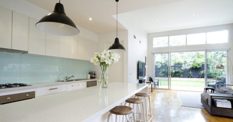 A large modern style kitchen with breakfast bar