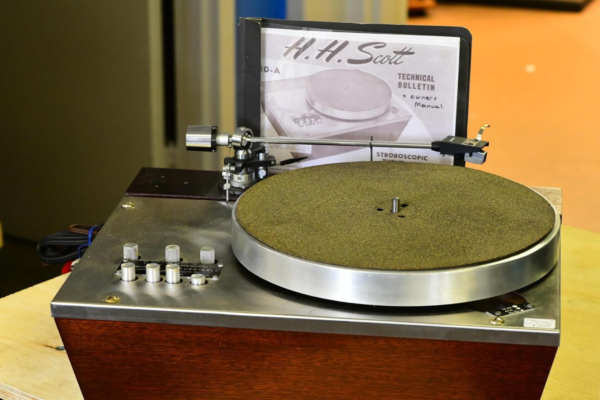 A h.h. sart record player is sitting on a table