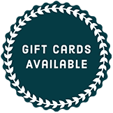 A sticker that says `` gift cards available '' with a wreath around it.