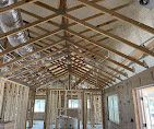 A house is being built and the ceiling is being insulated.