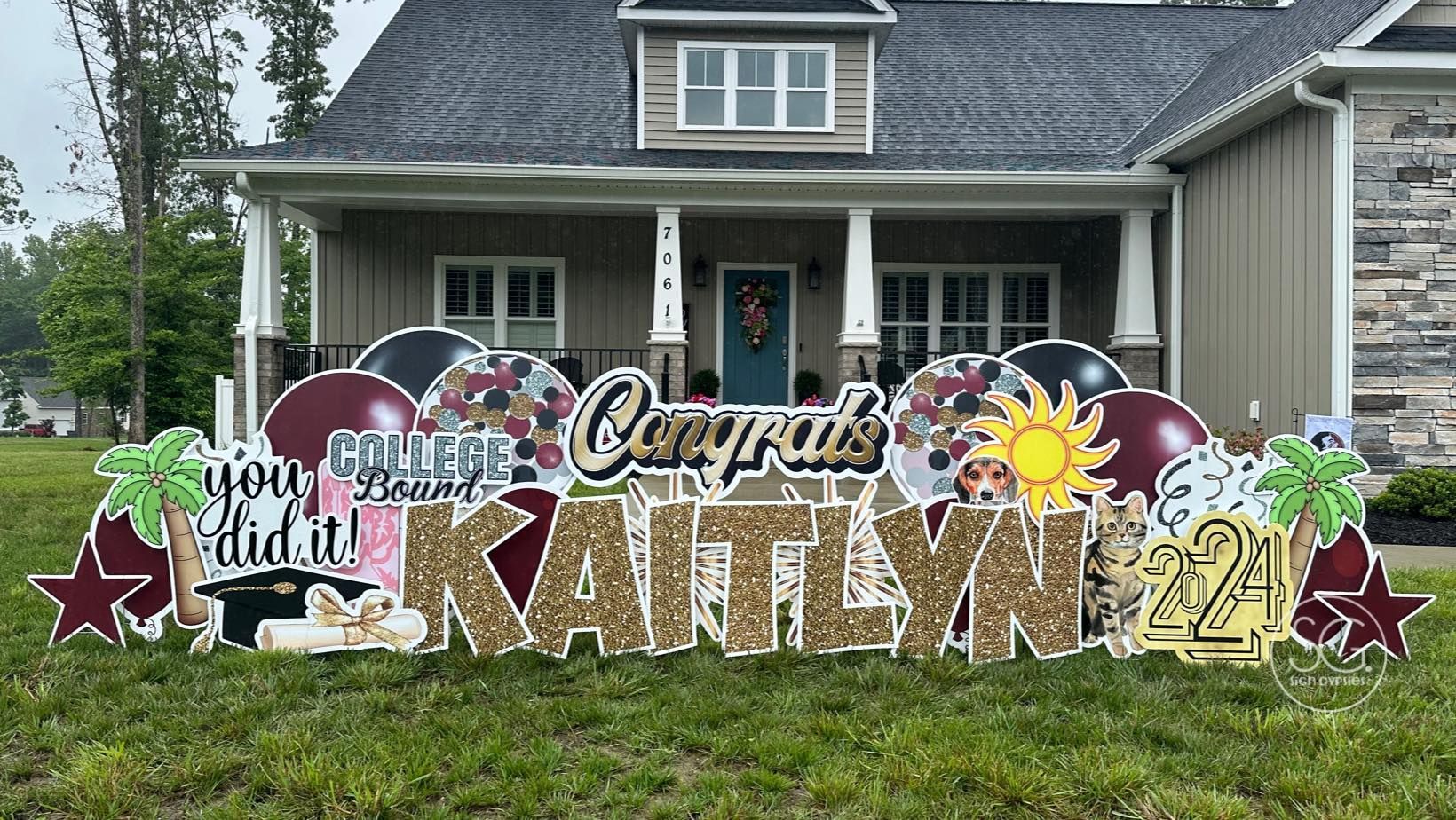 A congratulations sign is in front of a house.