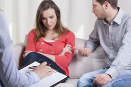 couple fighting in front of therapist