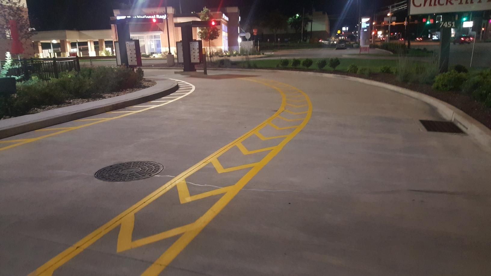 A parking lot with a chick-fil-a sign in the background