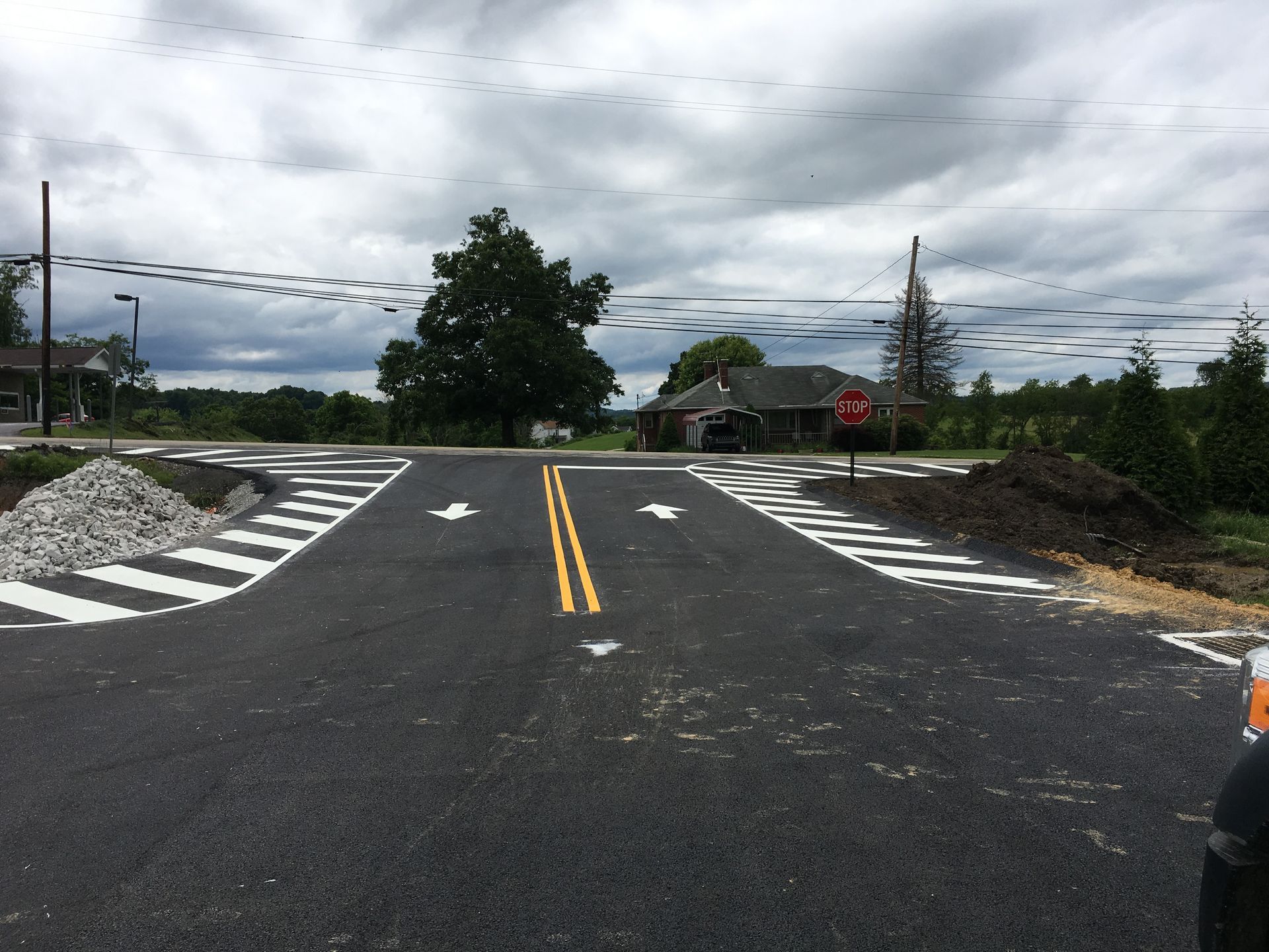 A zebra crossing is painted on the side of a road