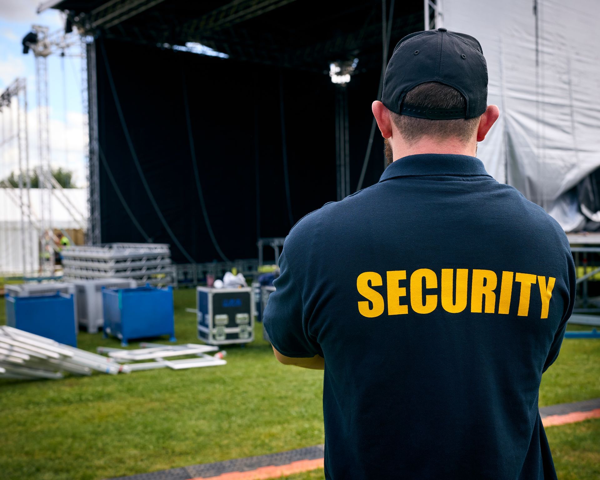 Security guard, back to the camera,