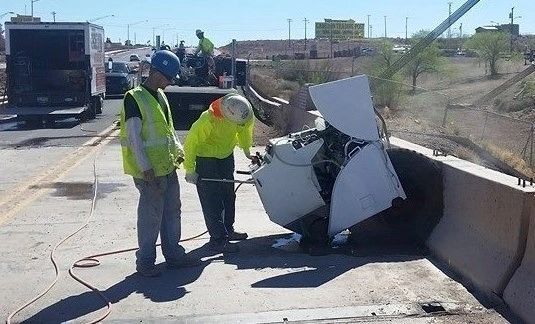 A group of construction workers are working on a bridge.