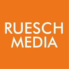 The logo for ruesch media is orange and white.