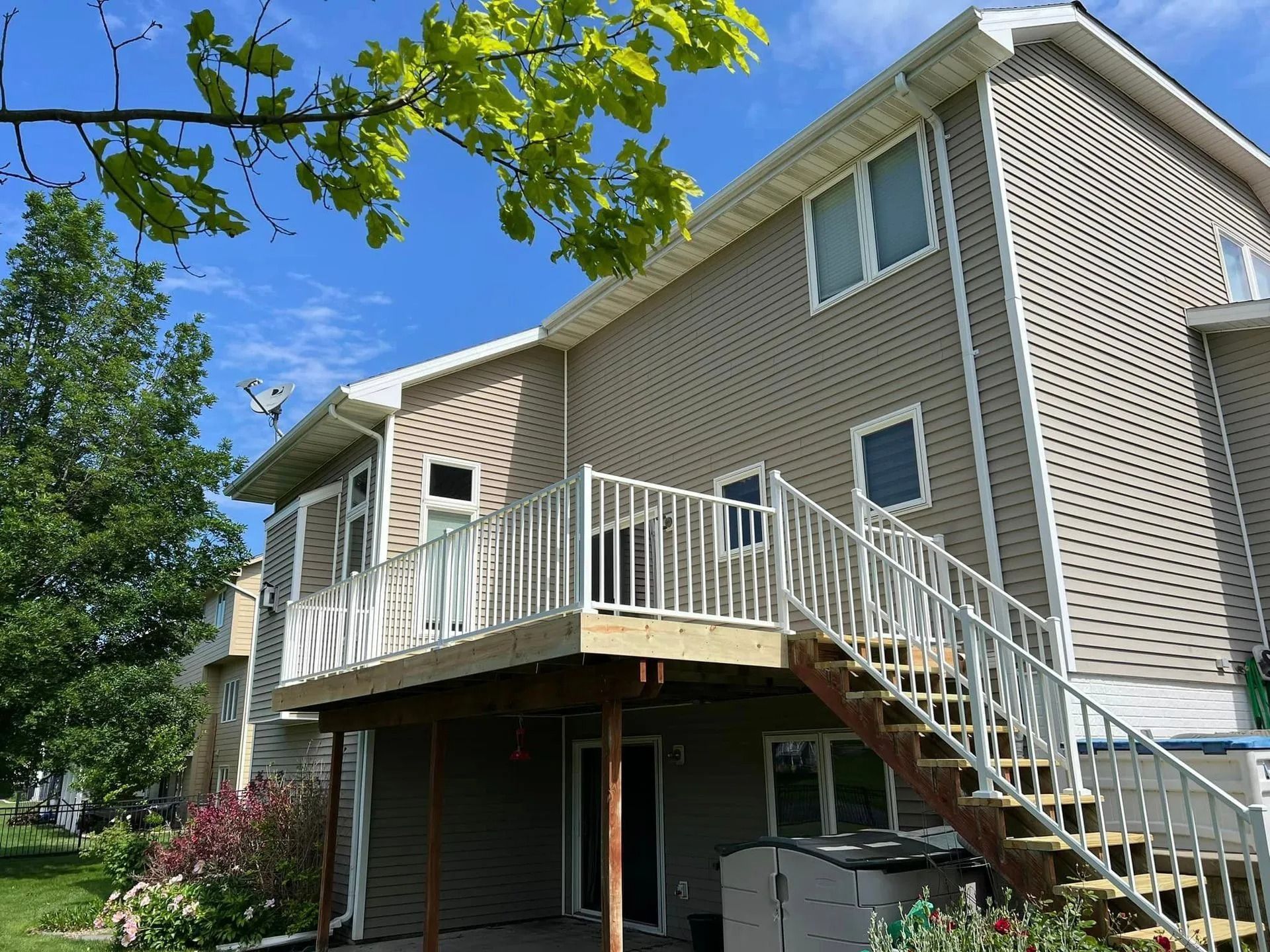 The back of a house with a deck and stairs