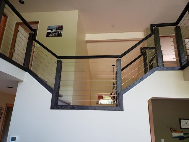 a staircase in a house with a glass railing
