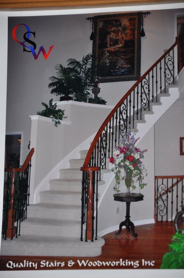 an ad for quality stairs and woodworking shows a curved staircase