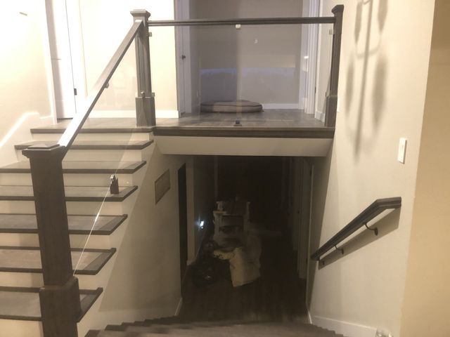 a person walking down a set of stairs in a dark room