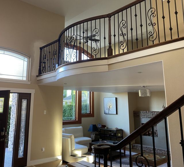a living room with a staircase leading up to the second floor