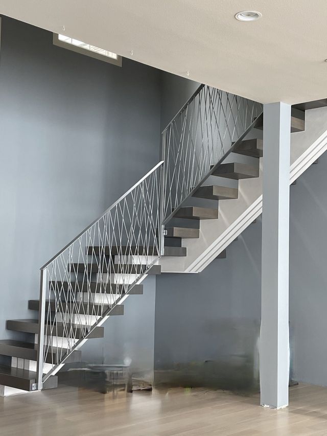 there is a staircase in the middle of the room .