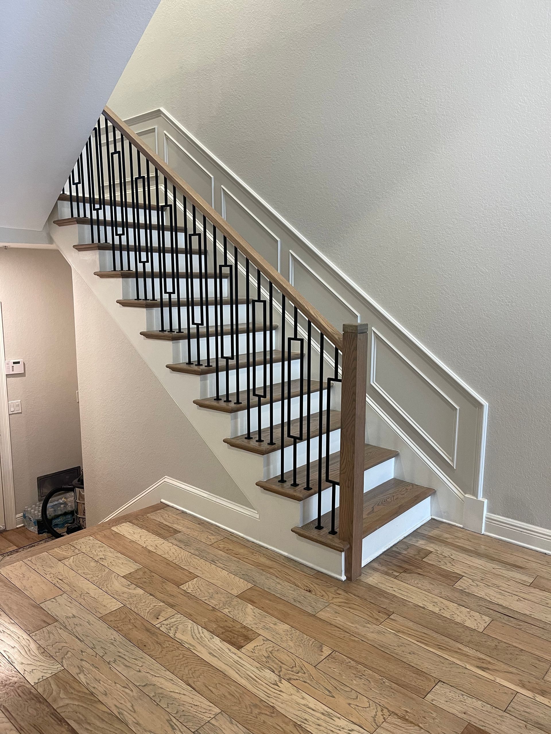 A staircase with wooden steps and a metal railing