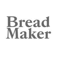 O logotipo da máquina de fazer pão é um logotipo cinza em um fundo branco.