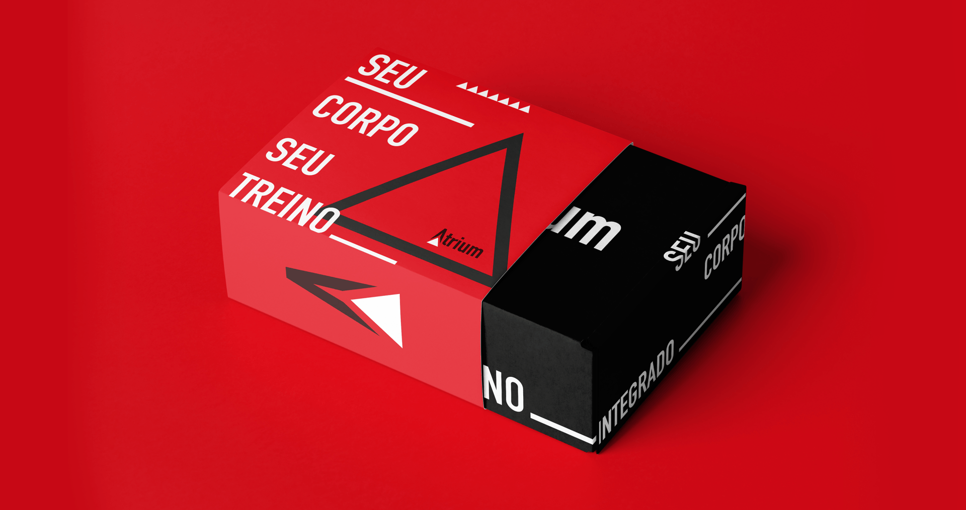 A red and black box is sitting on a red surface.