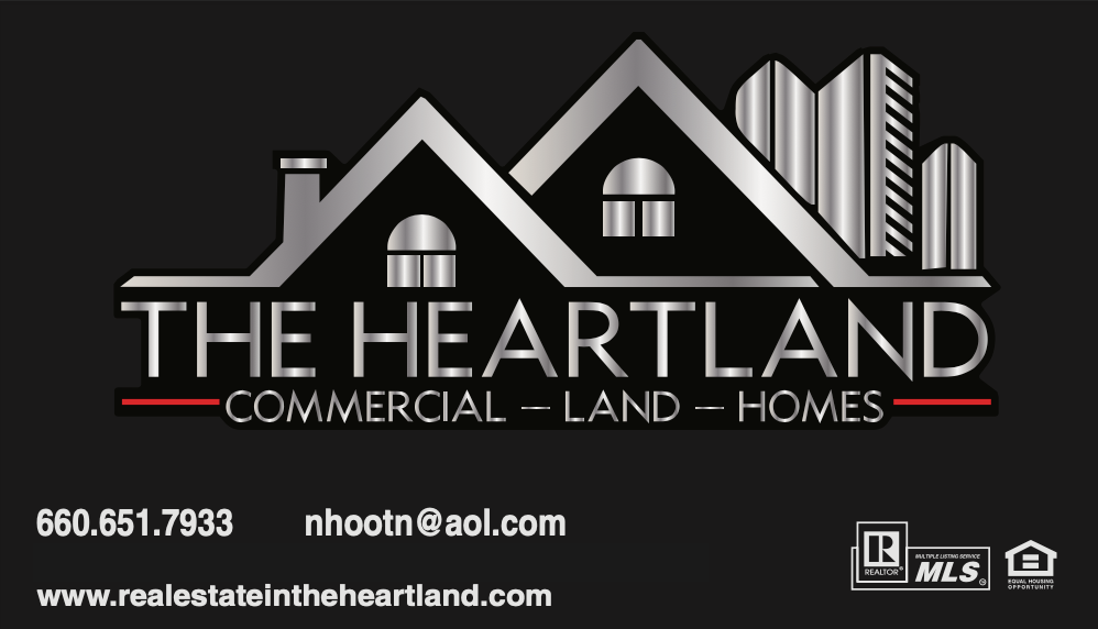 The heartland commercial land homes logo on a black background