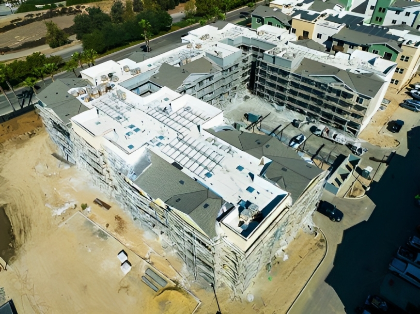 an aerial view of a large building under construction