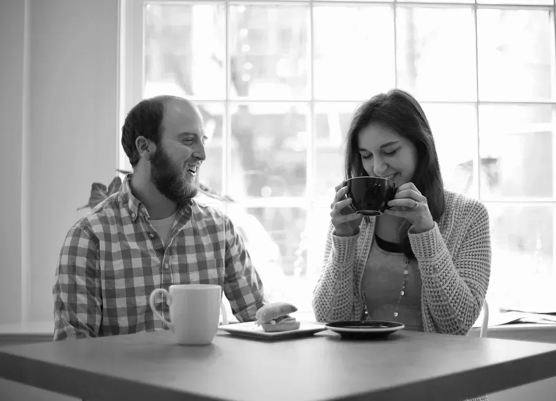 Black and white image of Seth and Mary Martin at a table with coffee Black and white image of Seth and Mary Martin at a table with coffee
