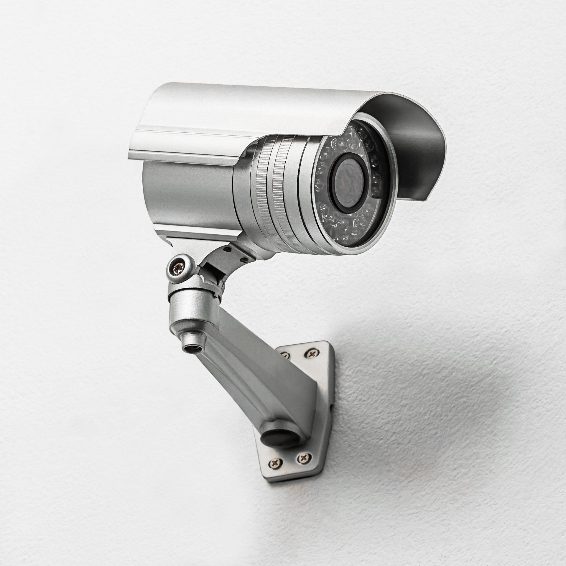 Modern security camera fix on the indoor concrete wall